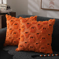 Harvest Haunt pillow covers: two pumpkin-orange 18x18 plush covers with a ghost motif, jack-o'-lantern glow for your sofa